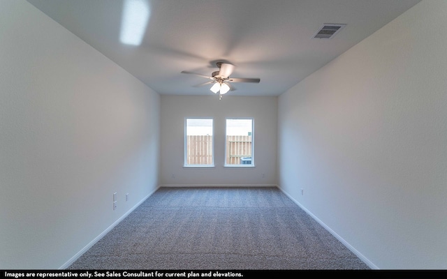 unfurnished room featuring light colored carpet and ceiling fan