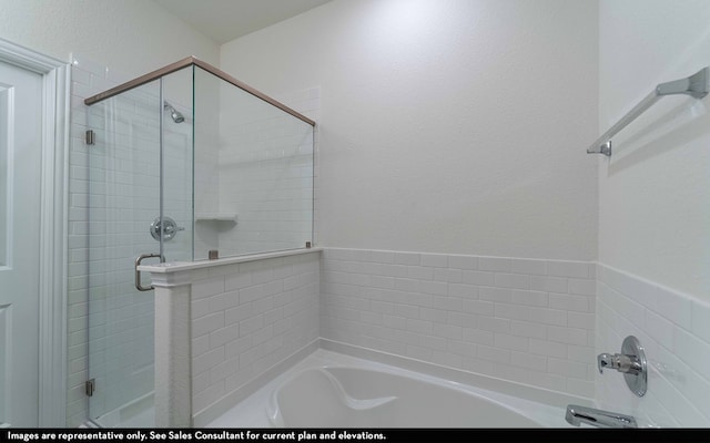 bathroom with separate shower and tub