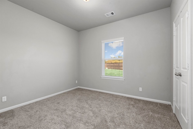 spare room featuring carpet