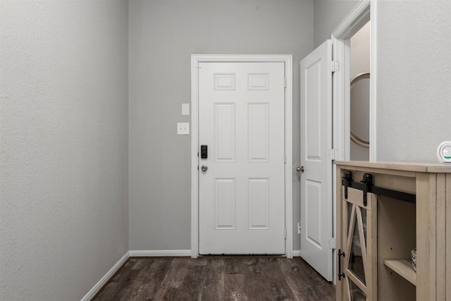 doorway to outside with dark hardwood / wood-style floors