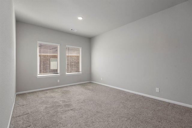 spare room featuring carpet floors