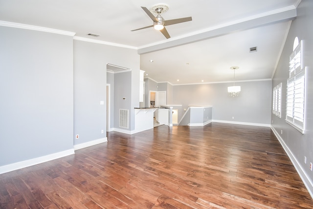 unfurnished living room with dark wood-type flooring, ornamental molding, and ceiling fan with notable chandelier