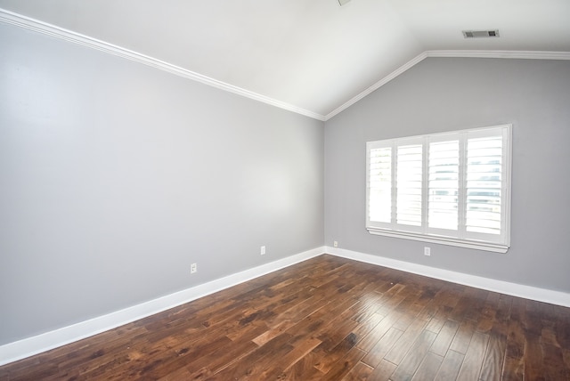 spare room with ornamental molding, vaulted ceiling, and dark hardwood / wood-style flooring