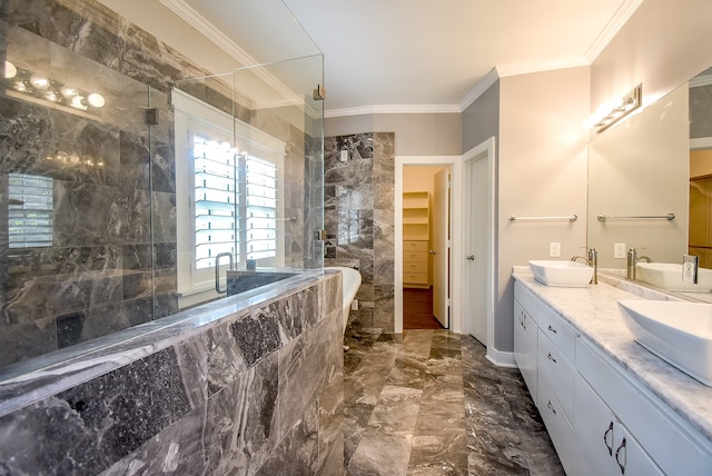 bathroom with vanity, ornamental molding, and separate shower and tub