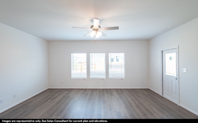 unfurnished room with dark hardwood / wood-style floors and ceiling fan