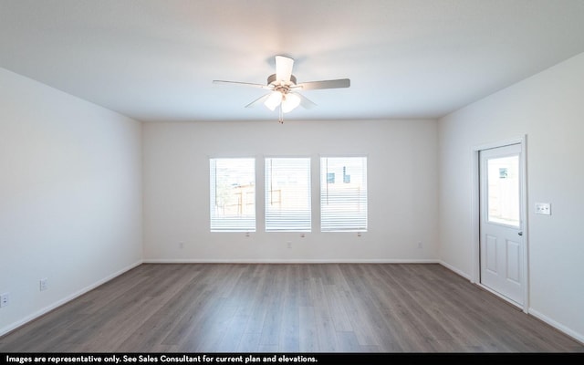 unfurnished room with ceiling fan, dark hardwood / wood-style floors, and a wealth of natural light