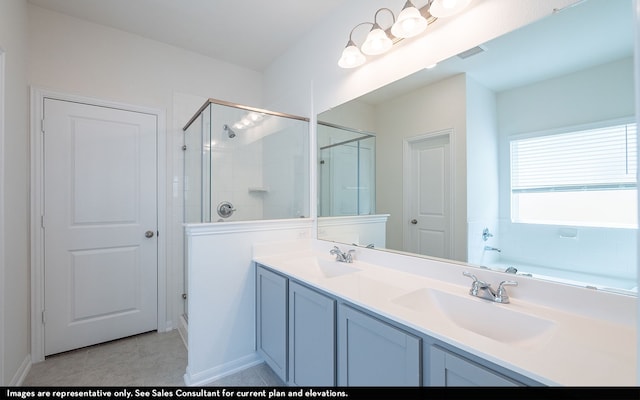 bathroom featuring vanity, tile patterned flooring, and an enclosed shower