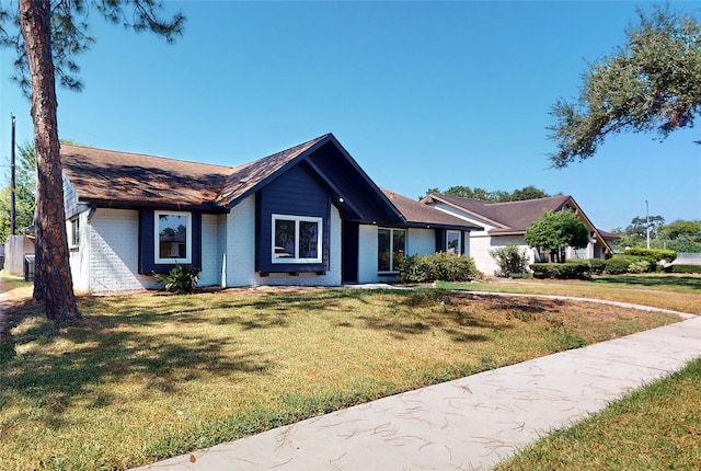 single story home with a front yard