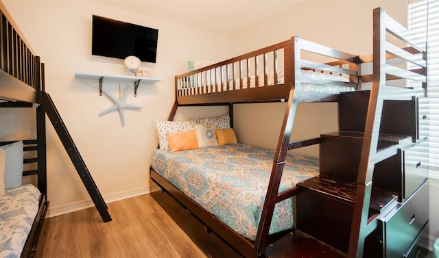 12919 Coronado Dr, Freeport, TX 77541 - bedroom with wood finished floors and baseboards