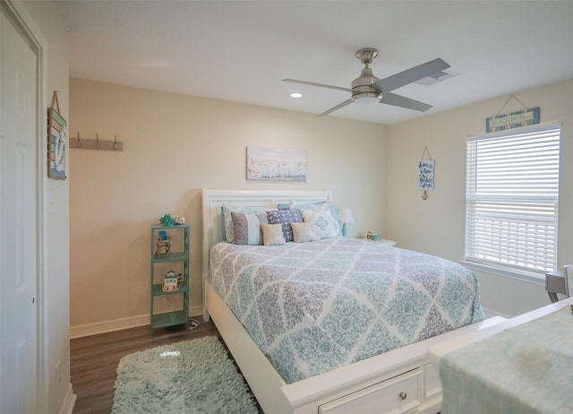 bedroom with dark wood-type flooring and ceiling fan