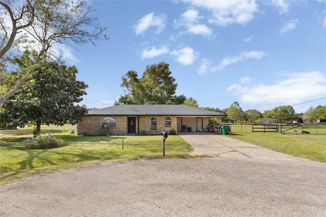 ranch-style house featuring a front lawn