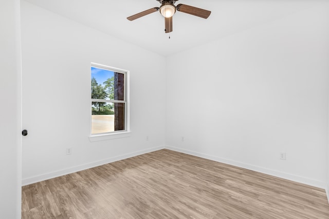 empty room with light hardwood / wood-style flooring and ceiling fan