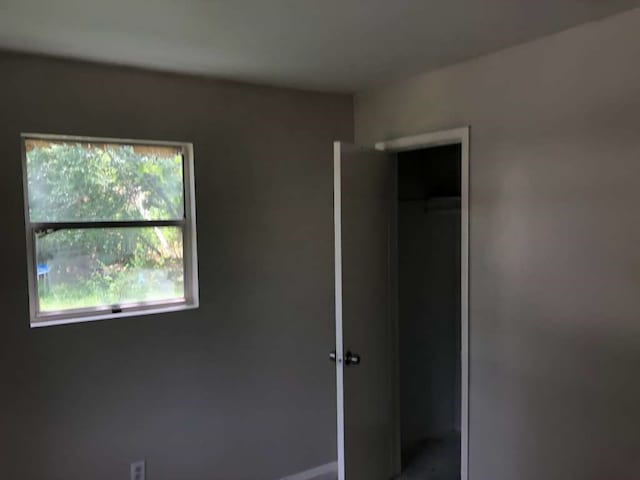 unfurnished bedroom featuring a closet