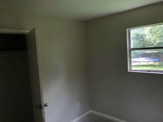 unfurnished bedroom featuring a closet