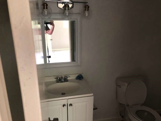 bathroom with vanity and toilet