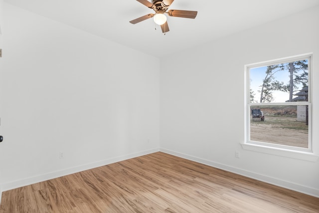 unfurnished room with light hardwood / wood-style flooring, a wealth of natural light, and ceiling fan