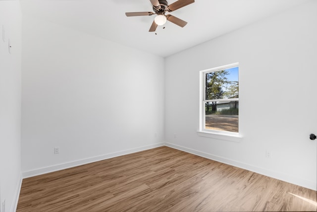 empty room featuring hardwood / wood-style floors and ceiling fan