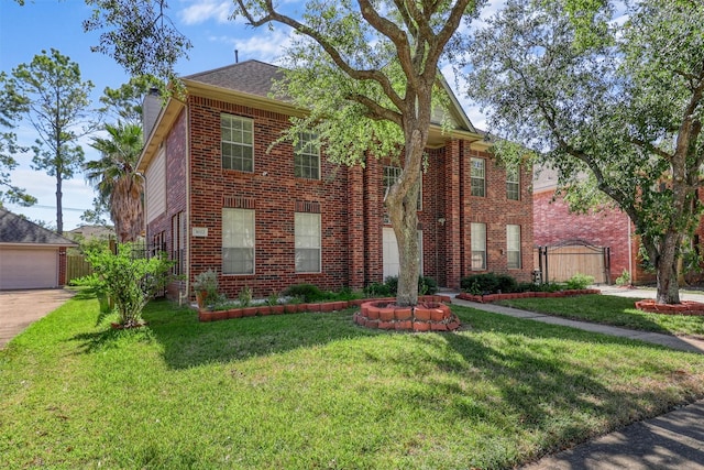 view of front facade featuring a garage and a front lawn