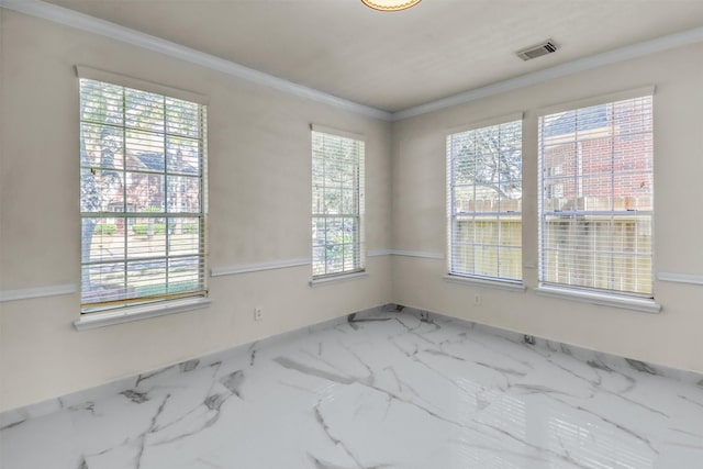 unfurnished room featuring ornamental molding and a healthy amount of sunlight