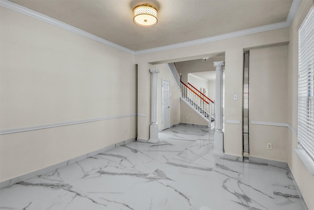 spare room with decorative columns and ornamental molding