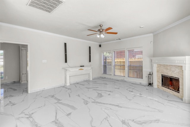 unfurnished living room featuring crown molding, ceiling fan, and a tile fireplace