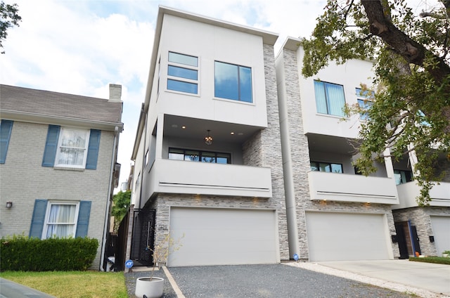 contemporary home featuring a balcony and a garage