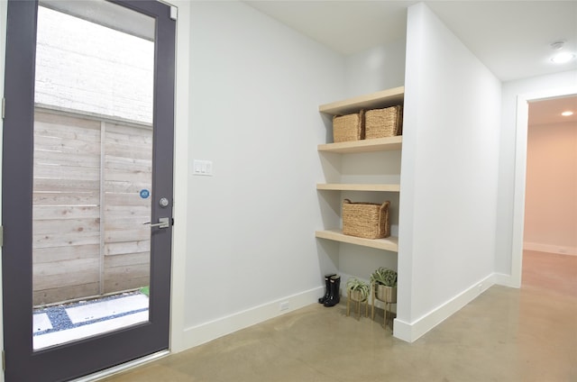 doorway featuring concrete floors