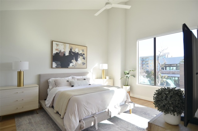 bedroom with light wood-type flooring and ceiling fan