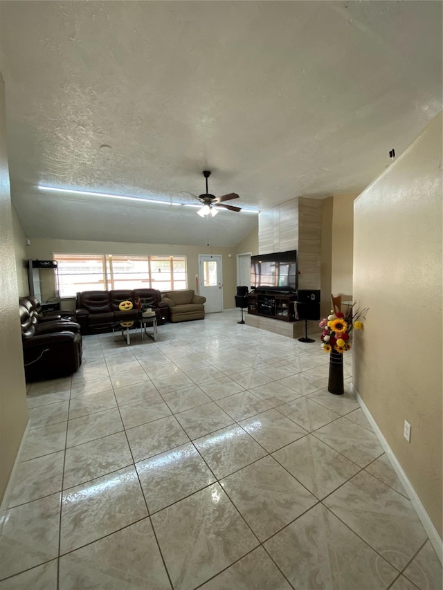 15810 Amapola Dr, Houston, TX 77083 - living room with a ceiling fan, baseboards, and light tile patterned floors