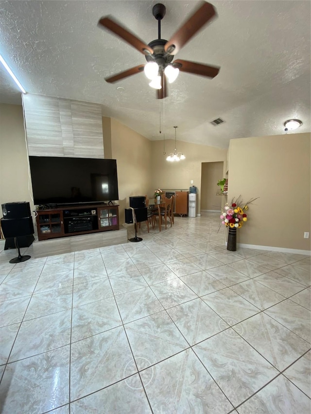 15810 Amapola Dr, Houston, TX 77083 - living room featuring a textured ceiling, lofted ceiling, visible vents, and ceiling fan with notable chandelier