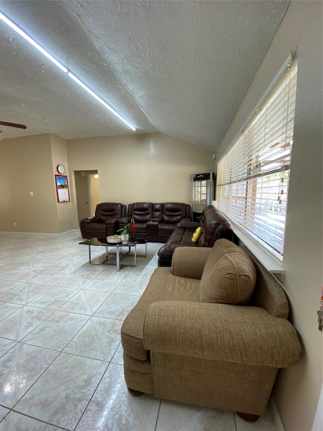 15810 Amapola Dr, Houston, TX 77083 - living room with vaulted ceiling, a textured ceiling, and light tile patterned flooring
