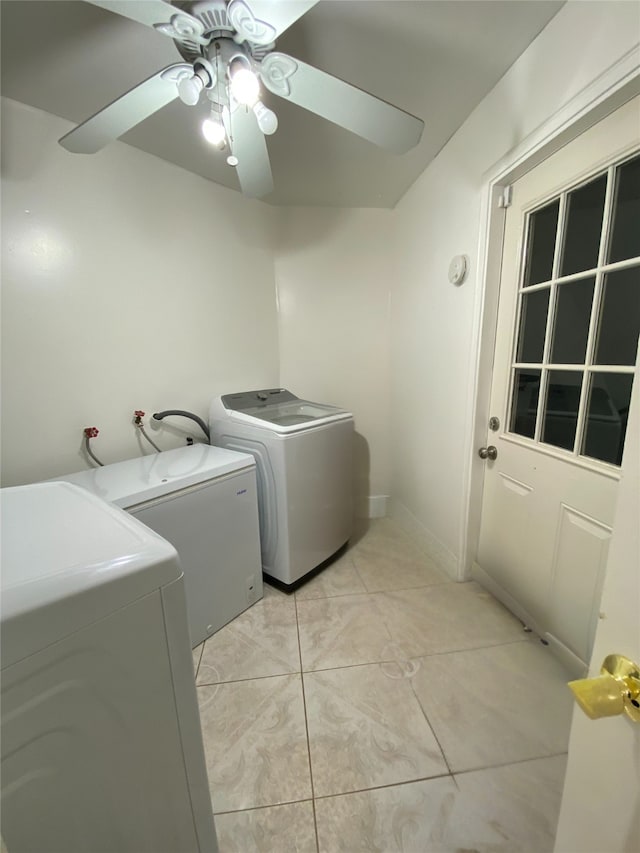 laundry area featuring independent washer and dryer, ceiling fan, and light tile patterned floors