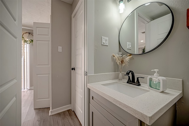 bathroom featuring vanity and hardwood / wood-style flooring