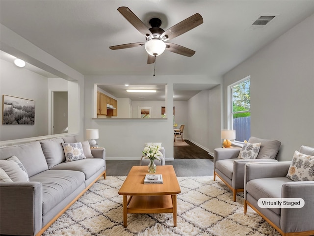 living room with ceiling fan