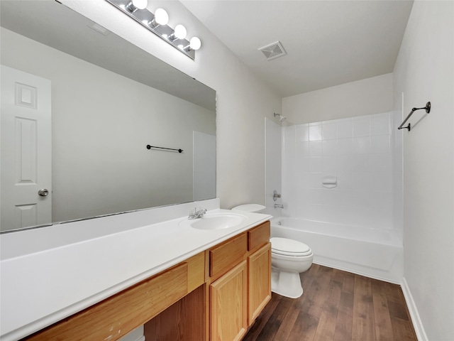 full bathroom featuring vanity, toilet, wood-type flooring, and washtub / shower combination