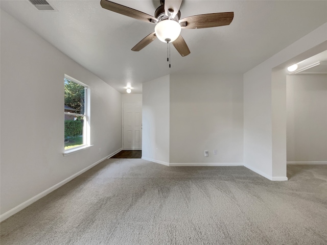 unfurnished room with carpet floors and ceiling fan