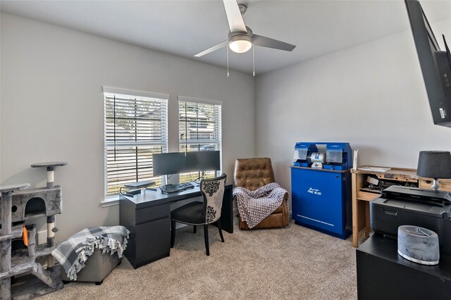 office space with light carpet and ceiling fan