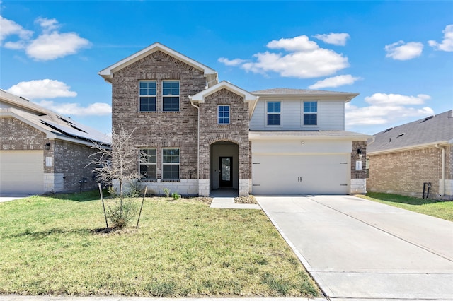 view of property featuring a garage and a front lawn