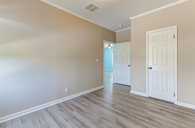 unfurnished bedroom featuring light hardwood / wood-style floors and crown molding