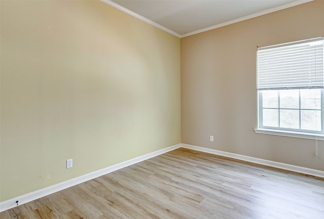 unfurnished room featuring crown molding and light hardwood / wood-style flooring