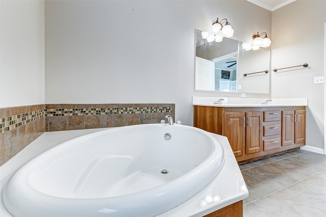 bathroom featuring vanity, crown molding, tile patterned floors, and a bathing tub