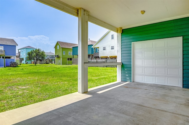 view of patio / terrace featuring a garage