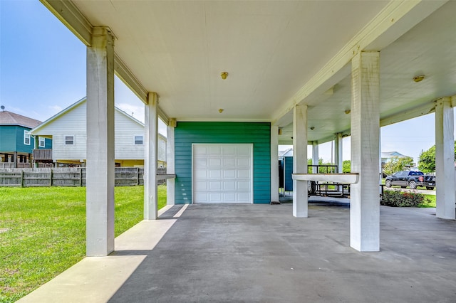 view of patio / terrace featuring a garage