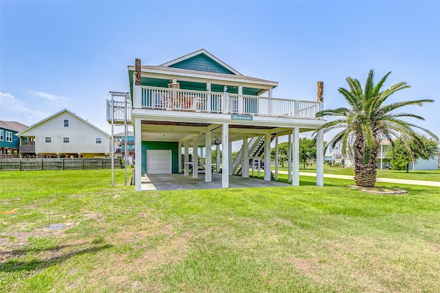 rear view of property with a yard and a carport