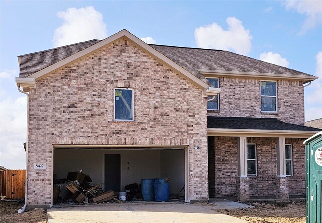 back of house with a garage