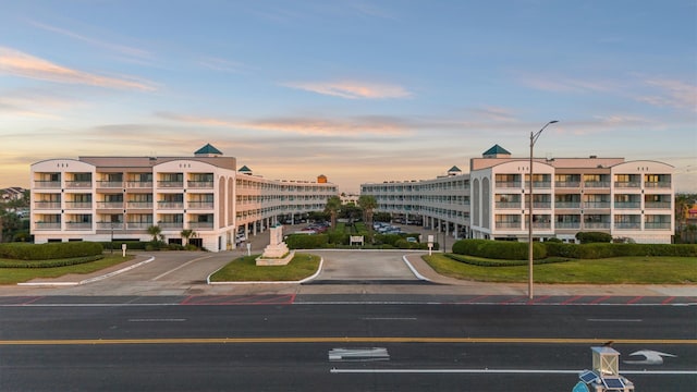 view of outdoor building at dusk