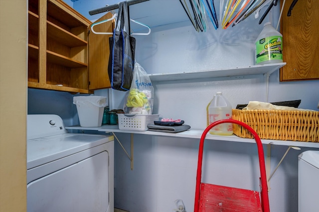 clothes washing area with independent washer and dryer