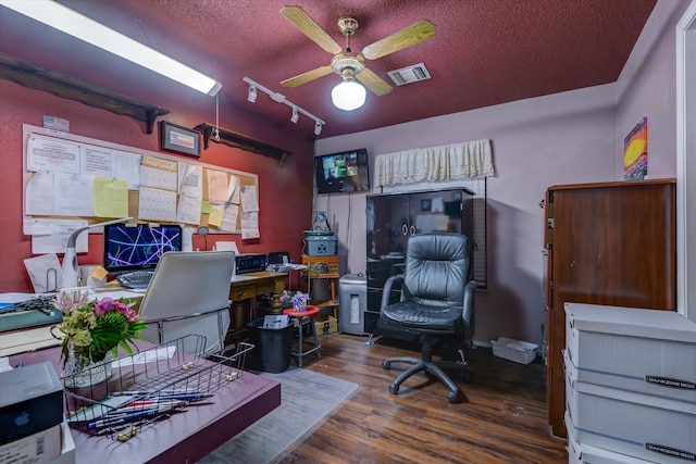 office area featuring dark hardwood / wood-style flooring, a textured ceiling, ceiling fan, and rail lighting