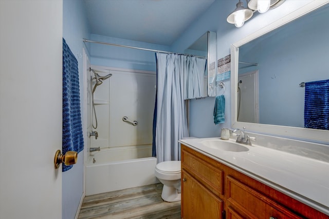 full bathroom with toilet, shower / tub combo, vanity, and hardwood / wood-style flooring