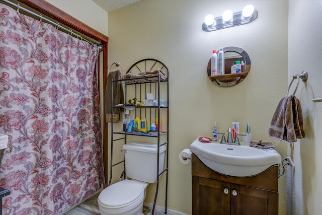 bathroom with toilet, a textured ceiling, hardwood / wood-style floors, a shower with shower curtain, and vanity